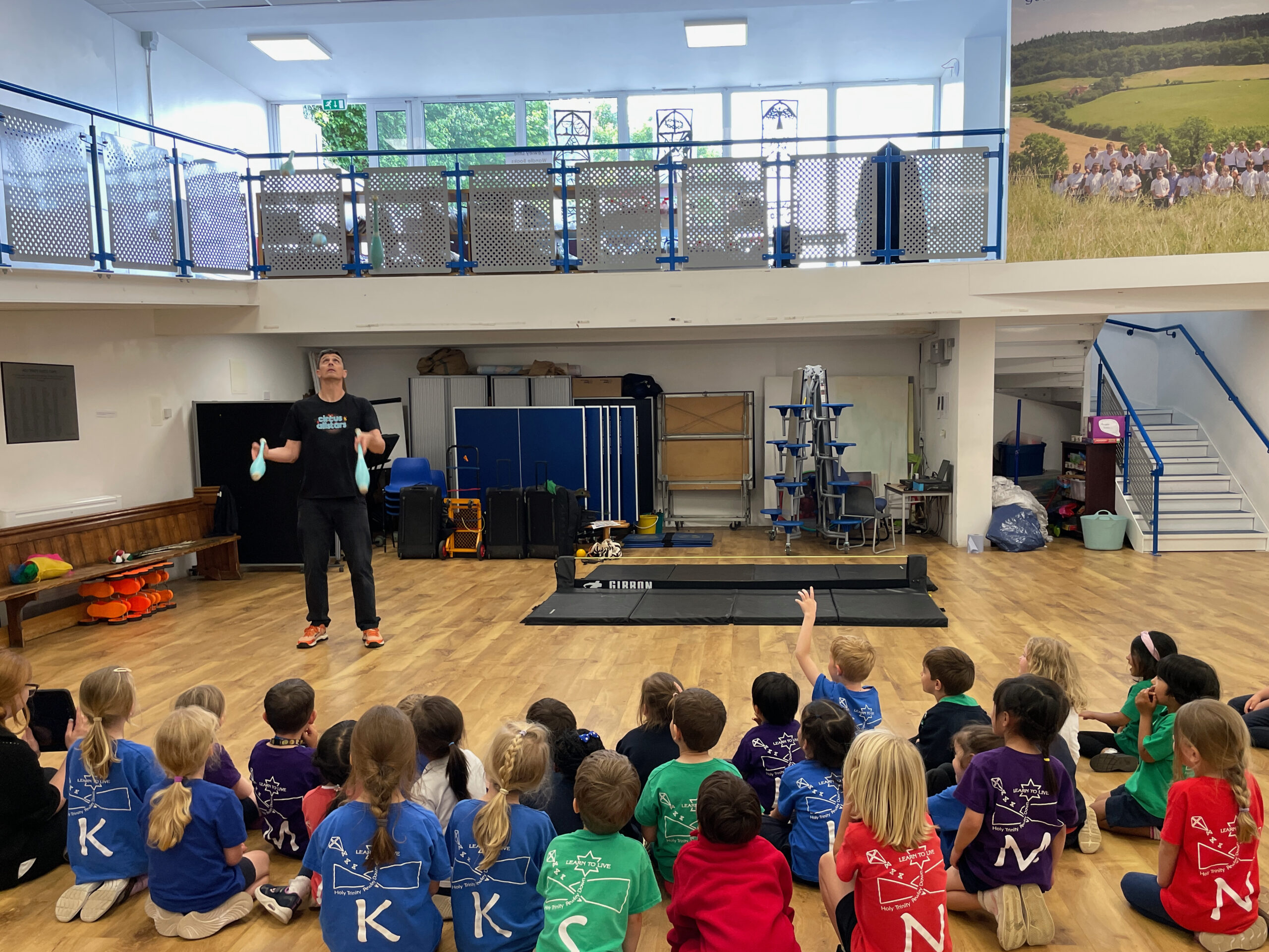 Circus teacher in a school juggles 5 clubs.