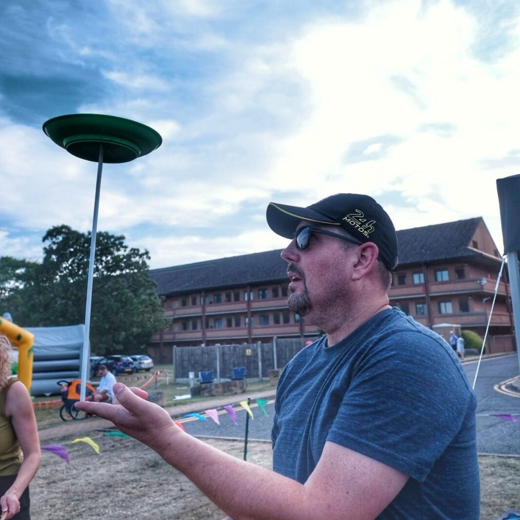 Circus skills area public event. Plate spinning